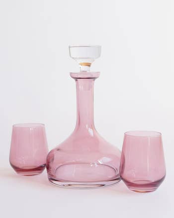 Elegant pink glass decanter with two matching glasses