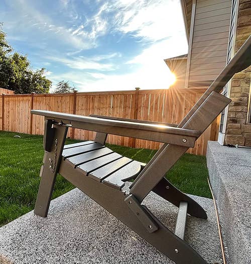 reviewer's gray Adirondack chair outside