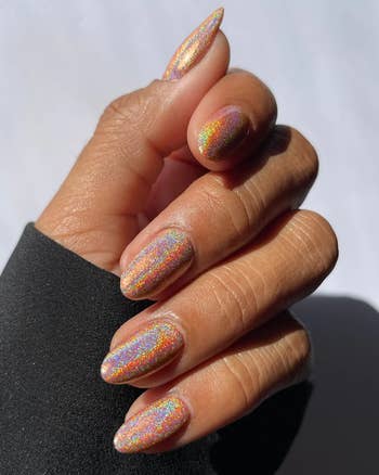 another angle of the model's holographic nails