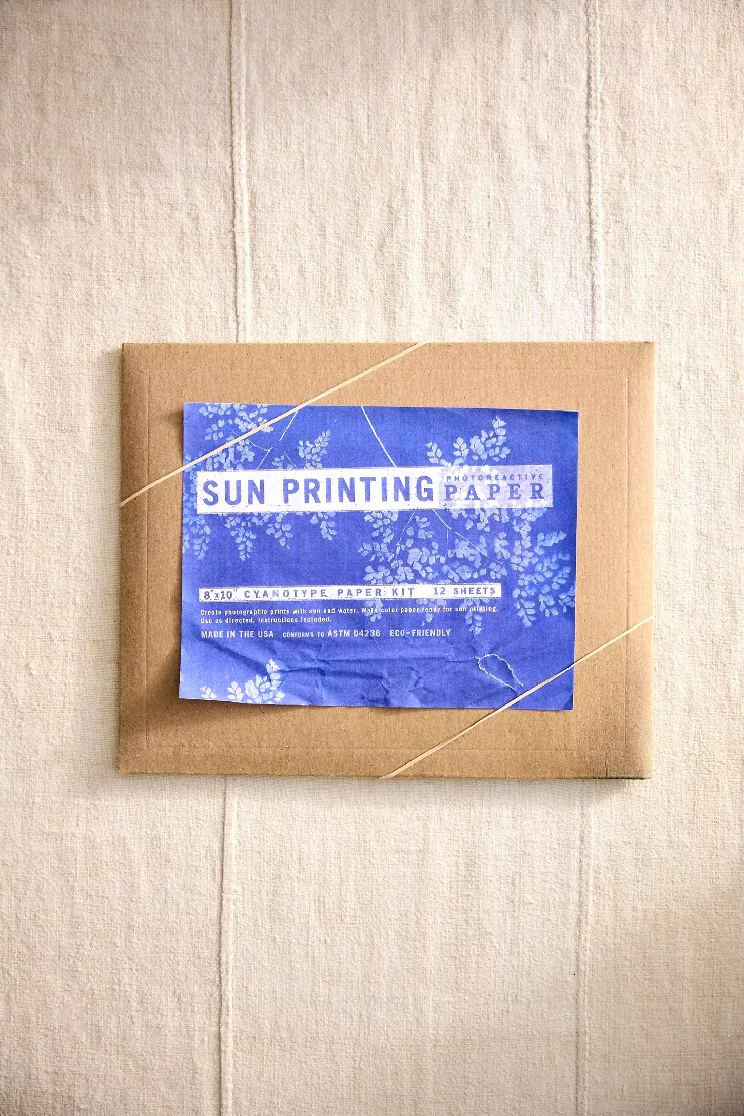 Envelope containing Sun Printing Paper with floral design on label, suitable for cyanotype printing projects. Eco-friendly and made in the USA