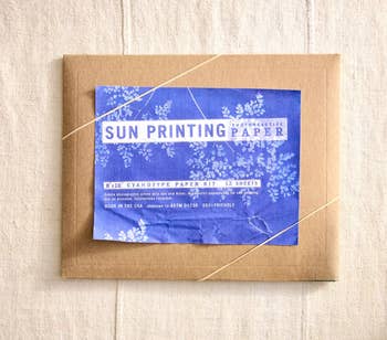 Envelope containing Sun Printing Paper with floral design on label, suitable for cyanotype printing projects. Eco-friendly and made in the USA