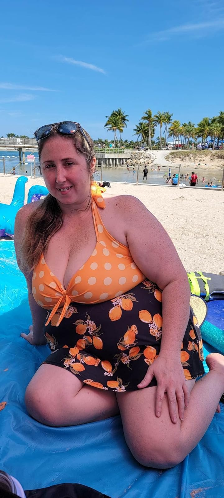 reviewer in the yellow polka dot swimsuit