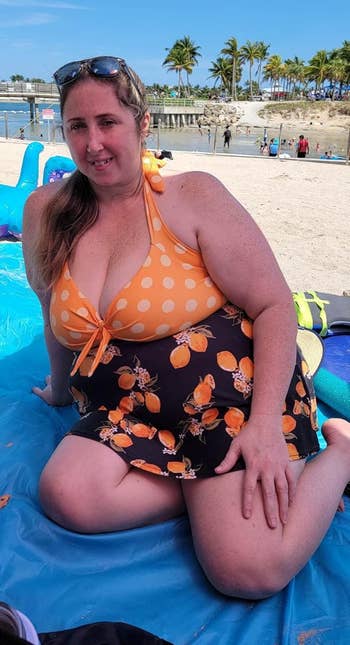 reviewer in the yellow polka dot swimsuit