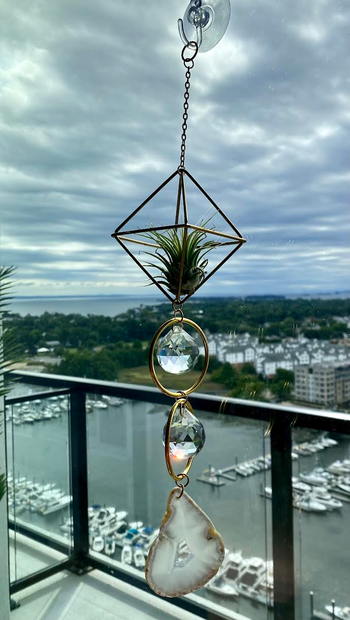BuzzFeed writer's image of the sun catcher with water background
