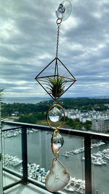 BuzzFeed writer's image of the sun catcher with water background