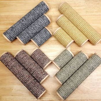 The three different sizes scratchers in four different colors laid on the floor