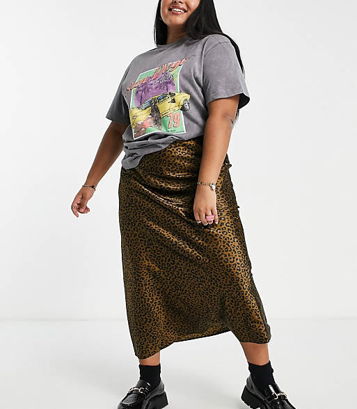 model in brown leopard print slip skirt with graphic tee