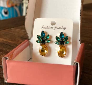 reviewer photo of the earrings in their packaging