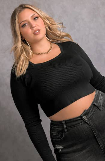 a close up picture of the same model wearing the crop top