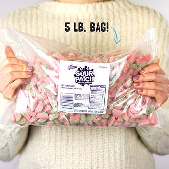 person holding the bulk bag with text reading 