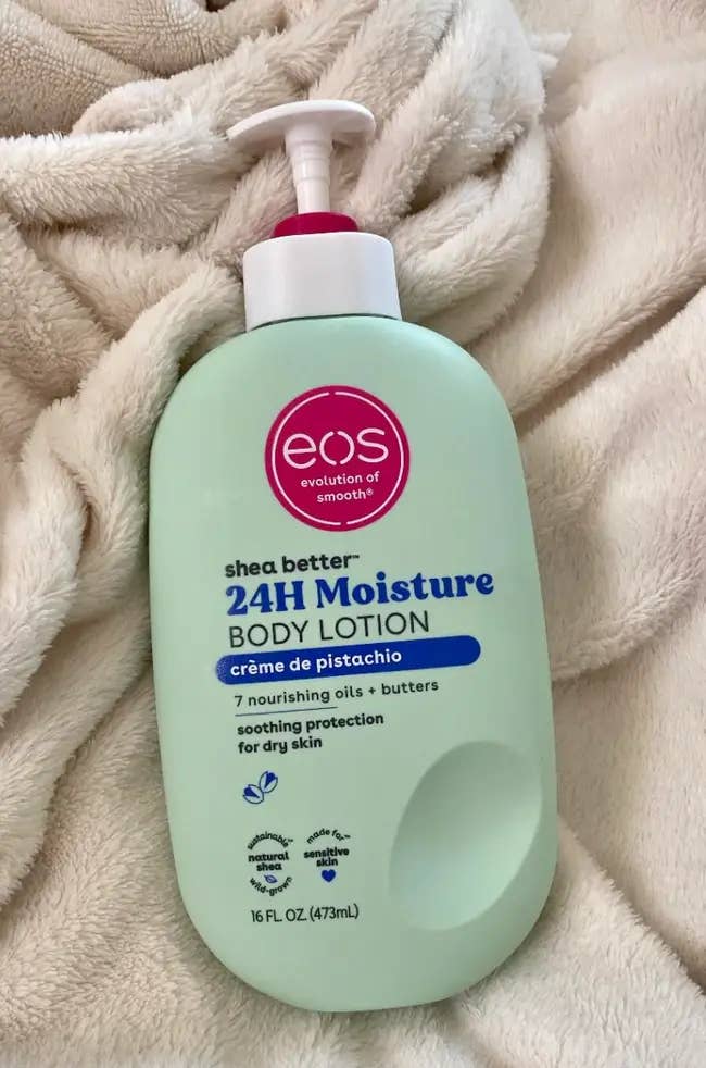 Bottle of EOS 24H Moisture Body Lotion, crème de pistachio scent, featuring 7 nourishing oils and butters for dry skin, 16 fl oz