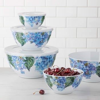 the mixing bowls in white with blue floral pattern on them