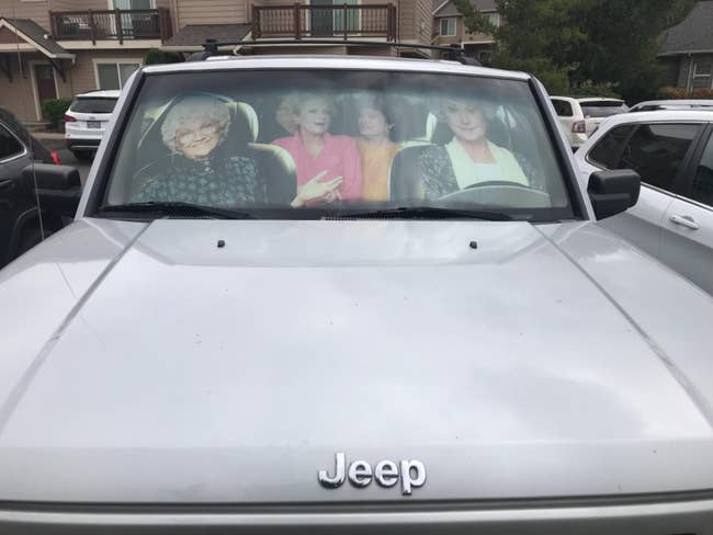 a reviewer's car with a visor in it that looks like the golden girls are in the car