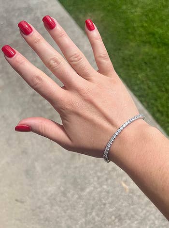 reviewer's hand with the bracelet on it