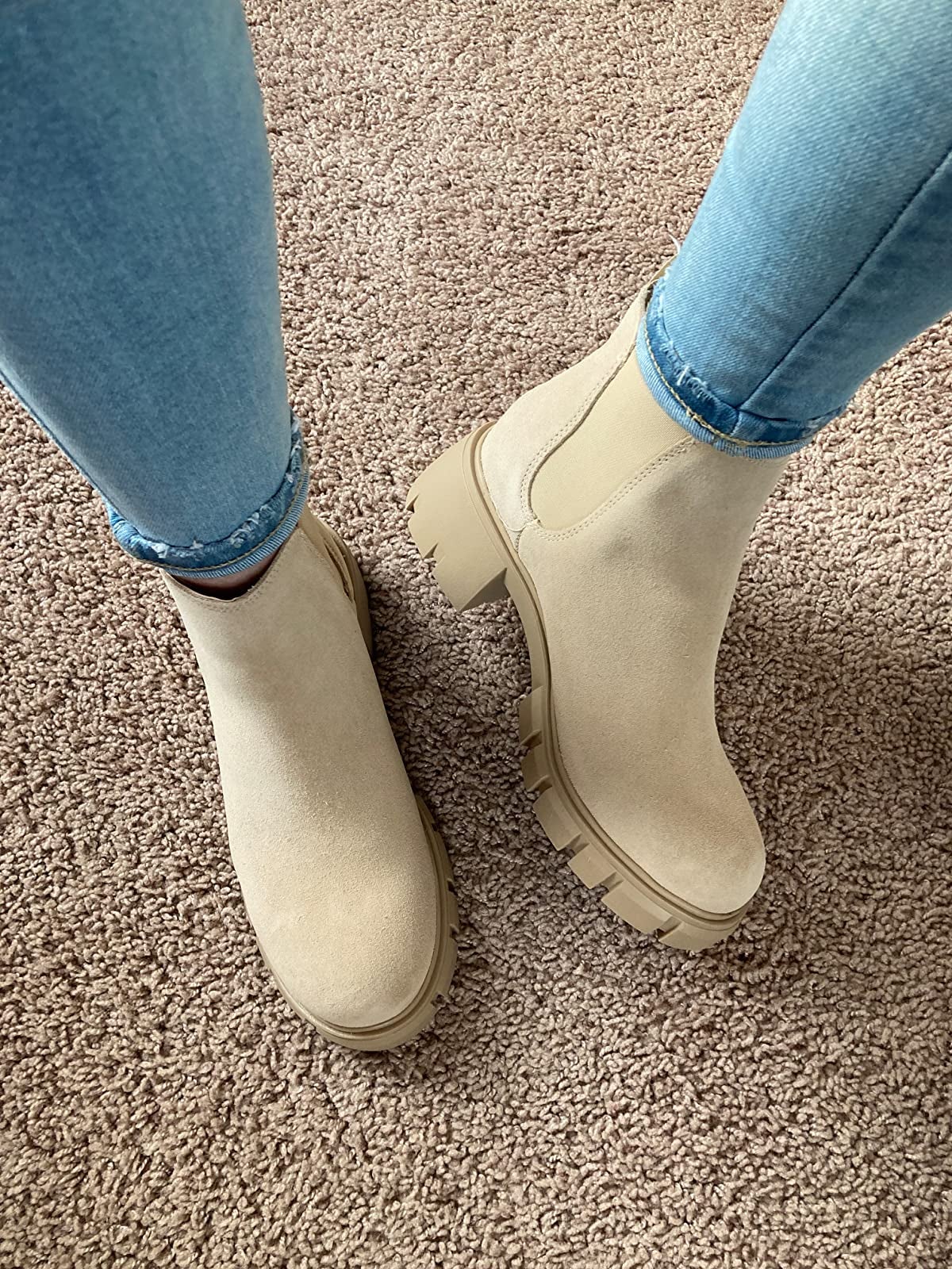 close up of the sand suede boots on a reviewer's feet