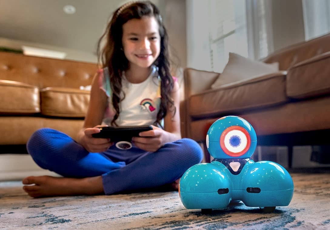 Child model playing with remote control blue orb robot toy
