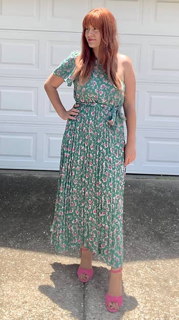 Reviewer wearing the dress in green floral