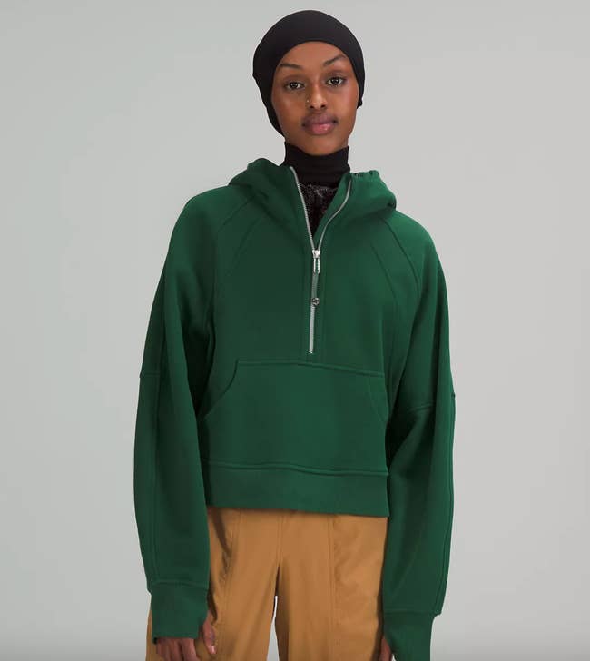 model wearing the hoodie in green