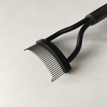 reviewer close up image of the eyelash comb