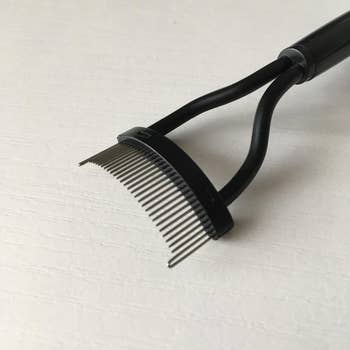 reviewer close up image of the eyelash comb