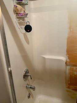 reviewers clean shower after scrubbing using drill brush