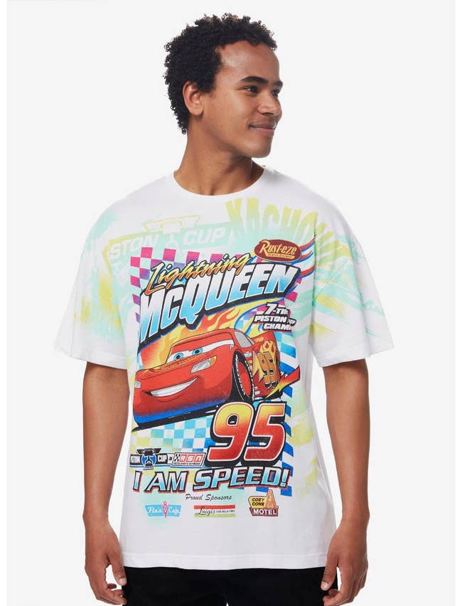 a model in a lightning mcqueen racing shirt