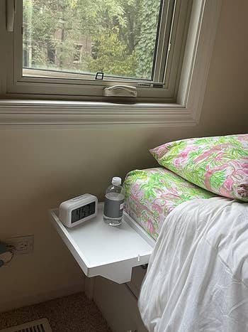 reviewer photo of clip-on bedside shelf
