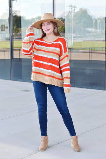 front view of model wearing the striped sweater