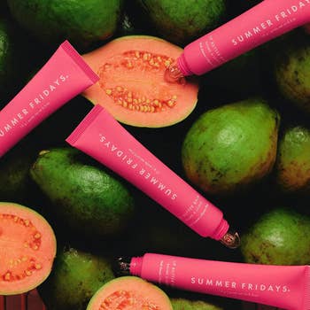Summer Fridays articulator food tubes are arranged among sliced guavas
