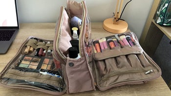 reviewer photo of cosmetics bag, compartments unzipped