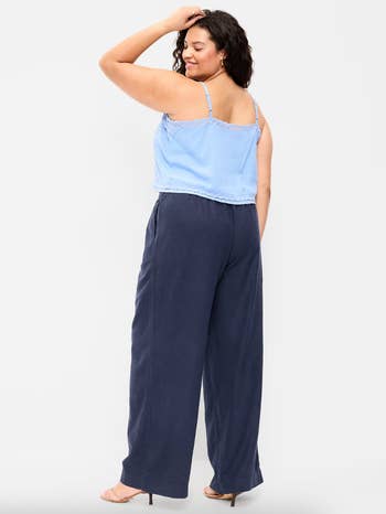 model wearing the pants successful navy with a babe bluish vessel top