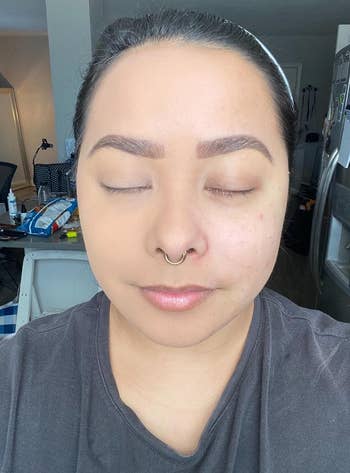 reviewer with foundation on half of face, other half without