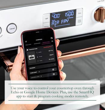 Person holding smartphone controlling a smart kitchen oven with app. Text promotes using Echo or Google Home for remote cooking mode setup