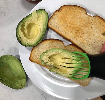 reviewer photo of the tool slicing an avocado