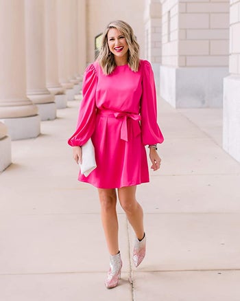model wearing the pink dress with ankle boots
