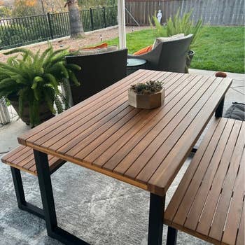 reviewer photo of picnic table in backyard