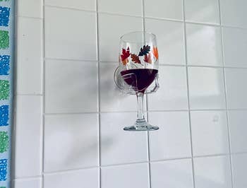 reviewer image of a glass of red wine resting in the wine holder