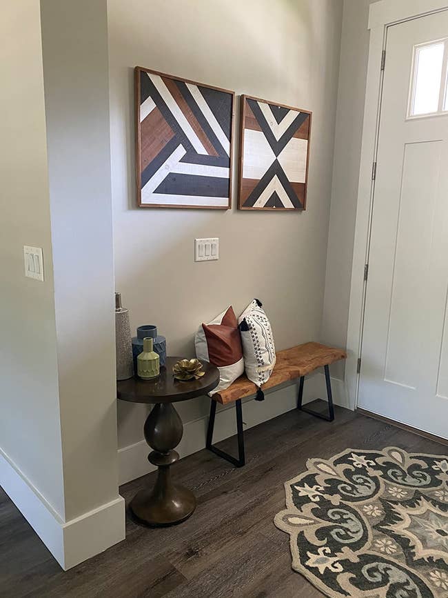 reviewer image of two shiplap wall pieces mounted on the entryway wall