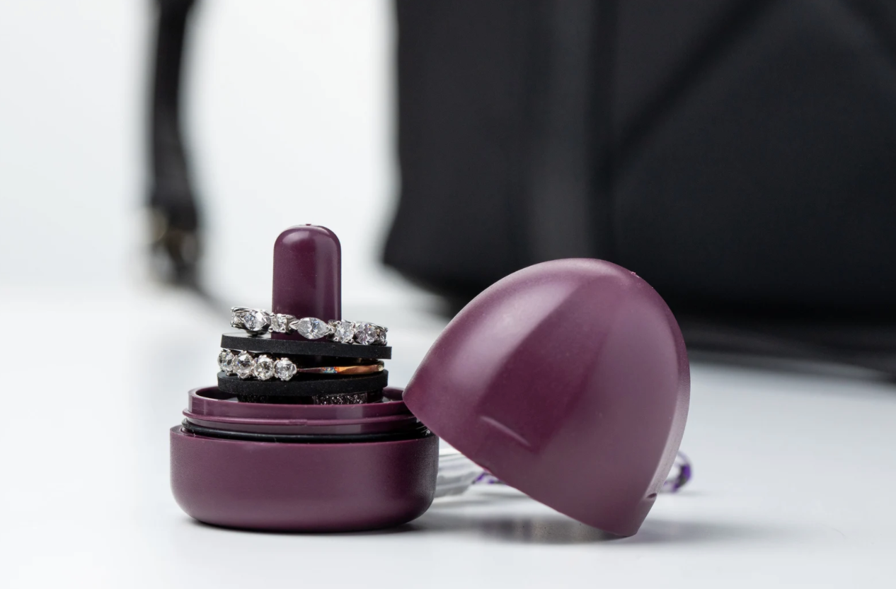 small purple ring holder with twist-on lid