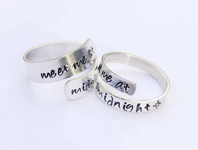 Image of two silver rings that say 