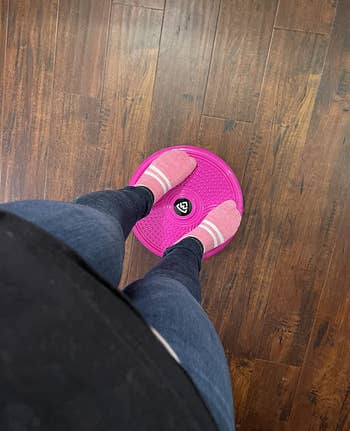 pic of floor view of reviewer standing on same pink twist board