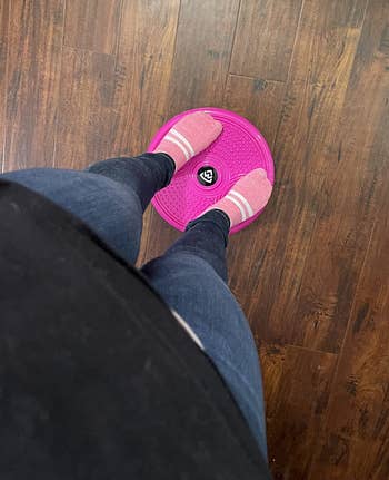 pic of floor view of reviewer standing on same pink twist board