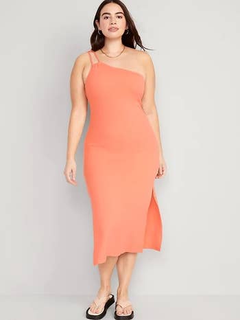 model wearing the tight one shoulder dress in peach
