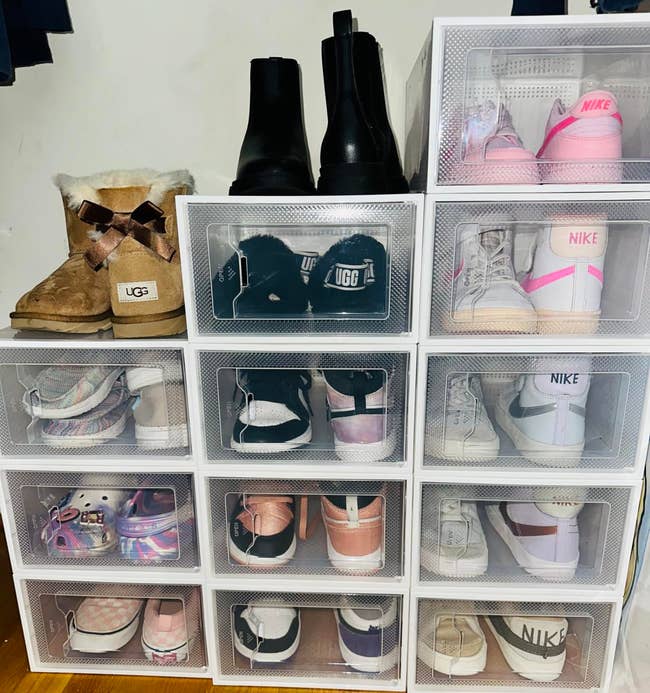 Stacked integrative  footwear  drawers filled with assorted  pairs of kids' shoes, including UGG boots, sneakers, and casual footwear from brands similar  Nike and Adidas