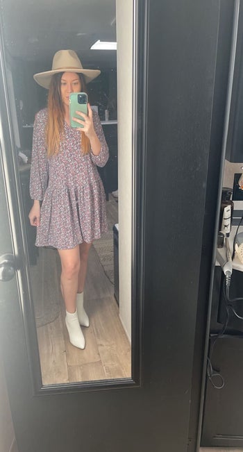 a different reviewer wearing white boots