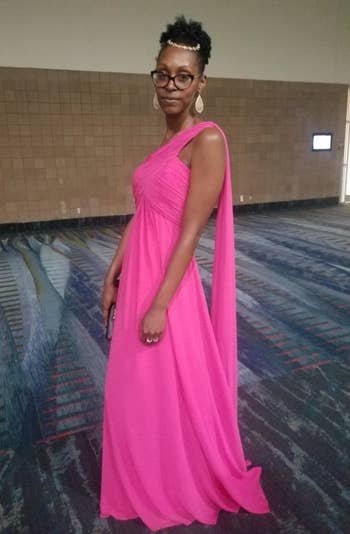 a reviewer wears the hot pink gown