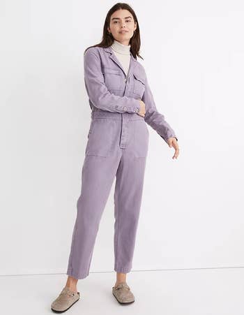 model wearing the lilac jumpsuit with a turtleneck underneath