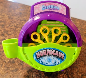 reviewer photo of the purple and green bubble machine