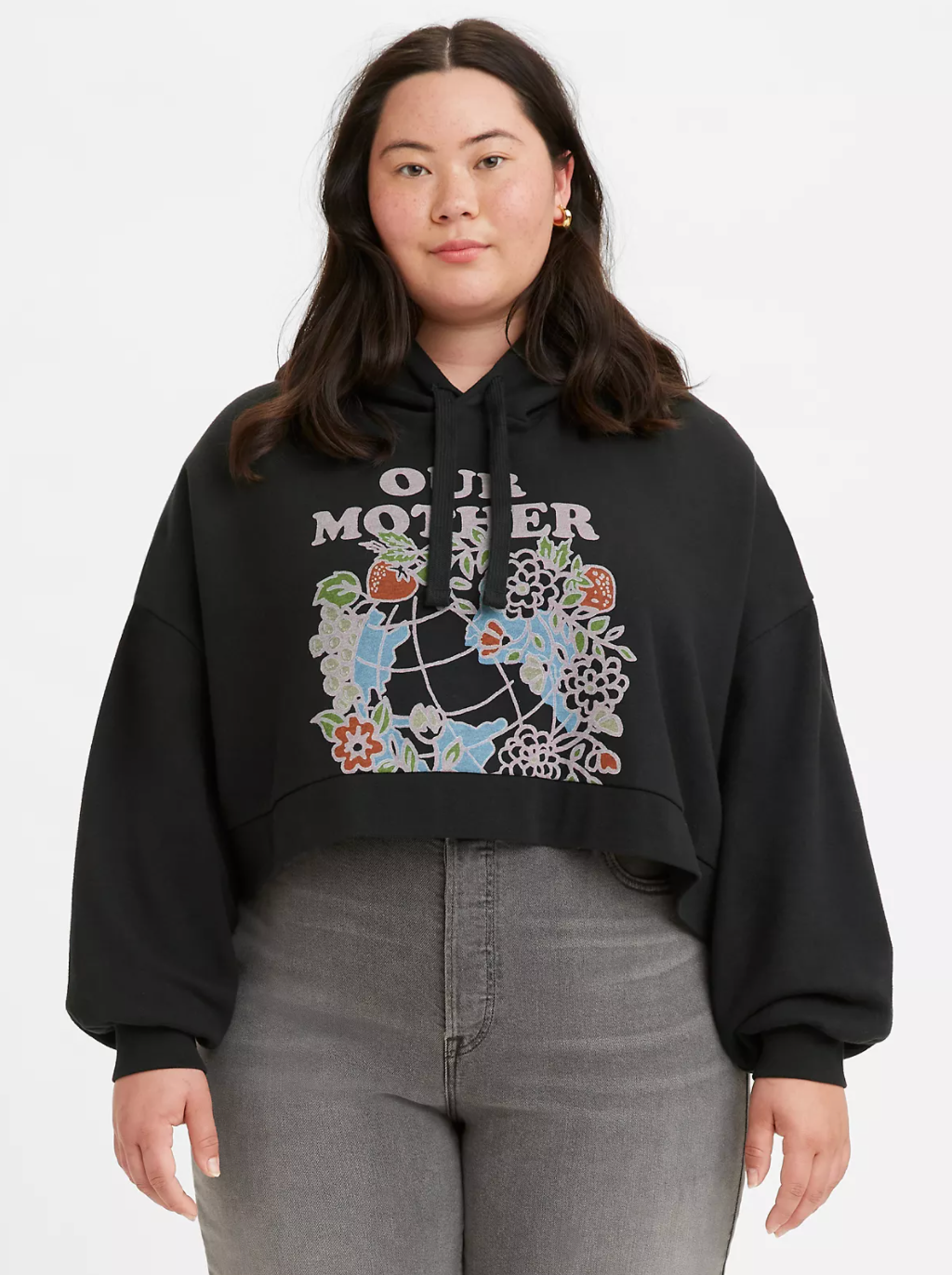 Model in black cropped hoodie with flower graphic that says 