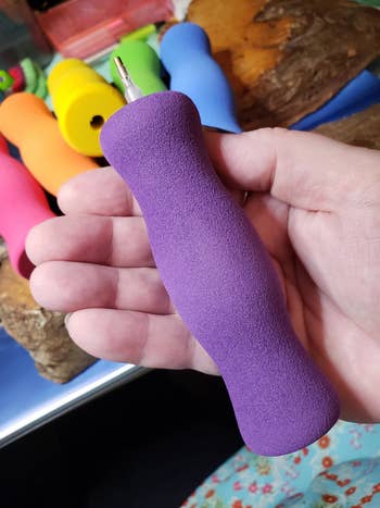 large purple foam grip on a crochet needle